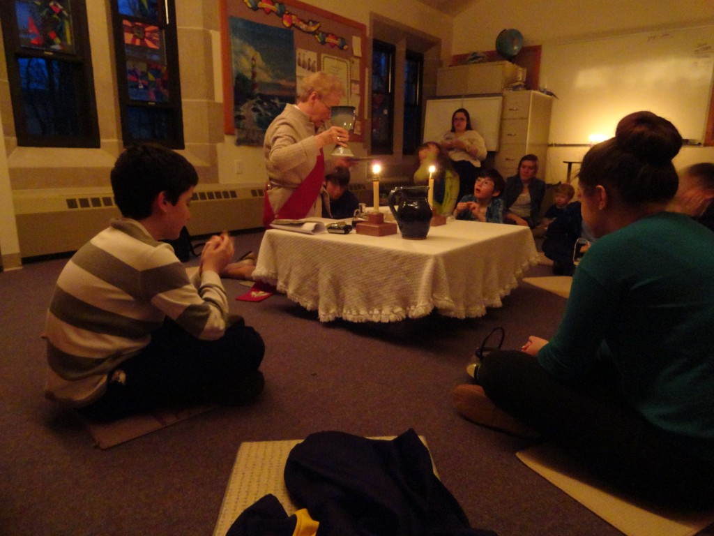 Deacon Christine celebrates the Eucharist with the children