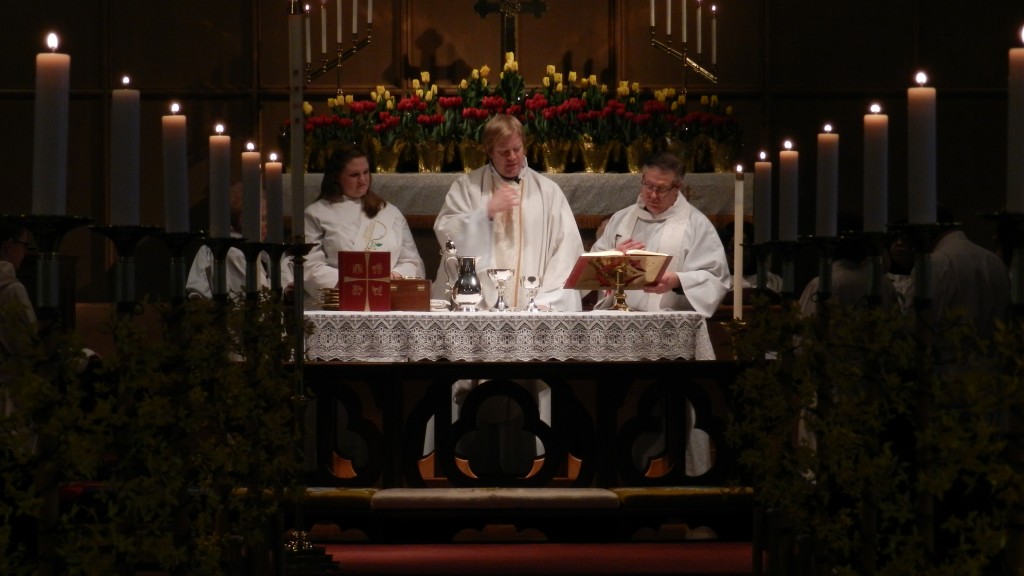 Fr. Charlie celebrates the Eucharist at the 8:30 service on Easter Day.